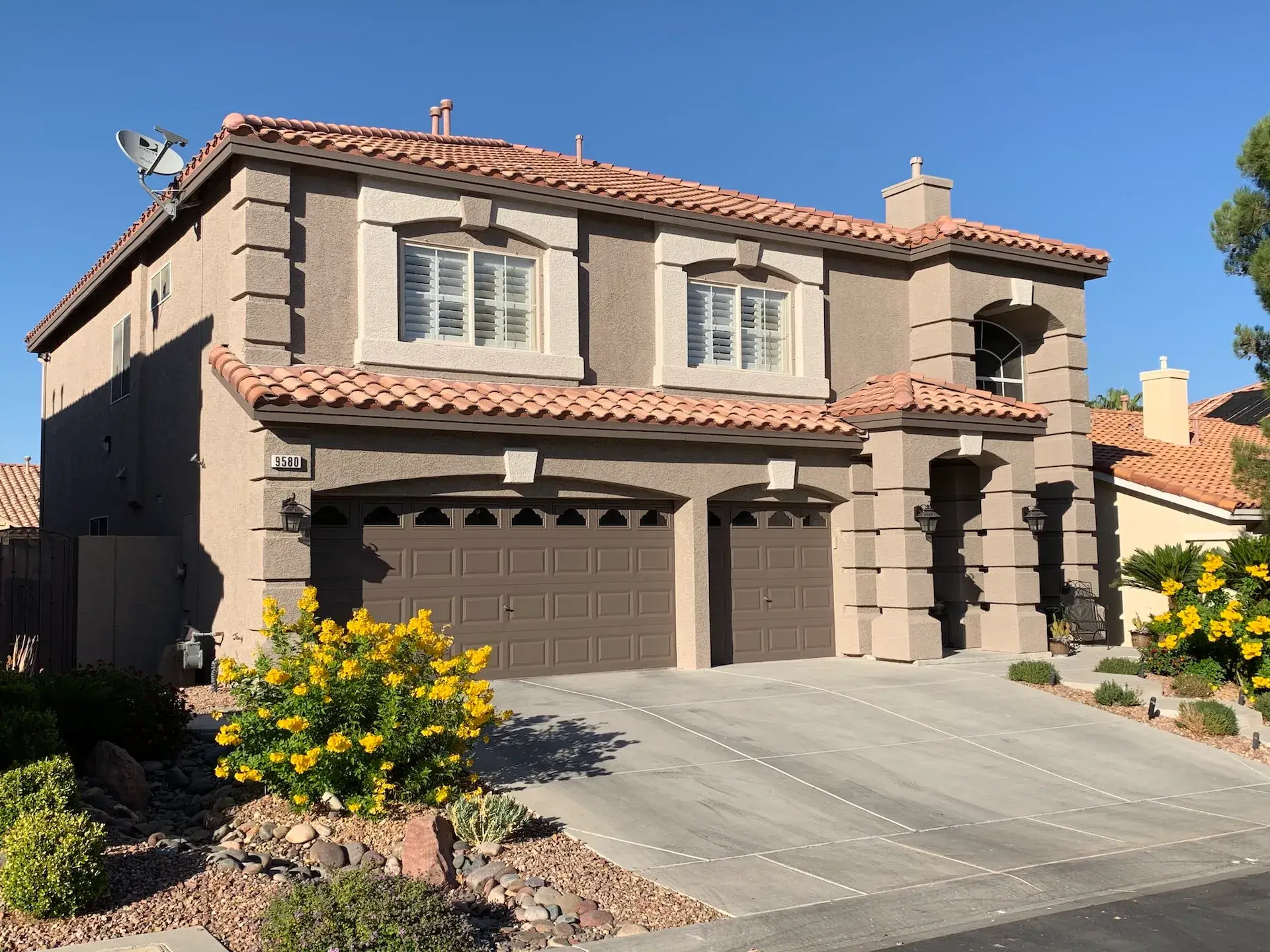The view of the exterior of a newly painted house by Spray n coat in Summerlin South NV